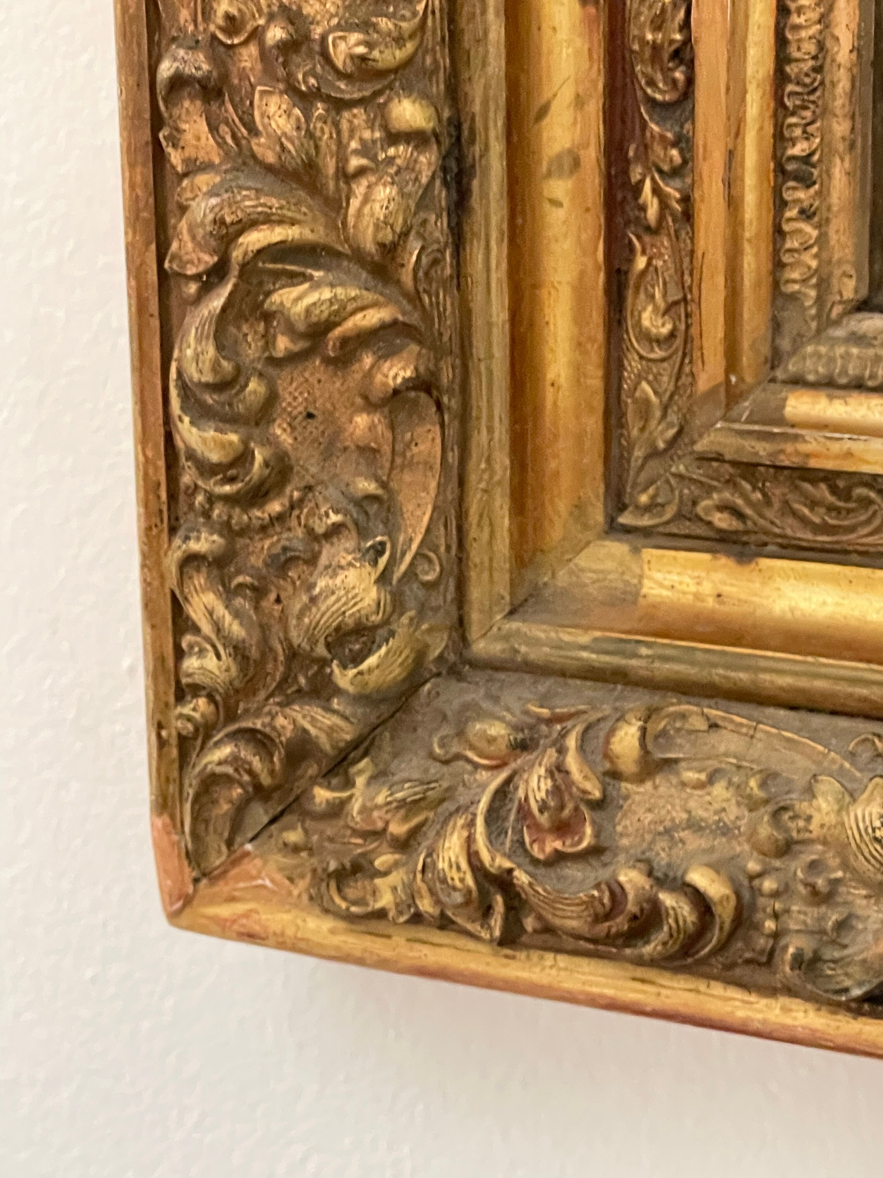 Antique mirror in gilded wood