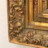 Antique mirror in gilded wood