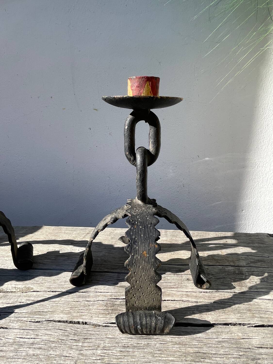 Pair of candlesticks with wrought iron chain