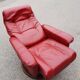 Red leather relax armchair and pouf