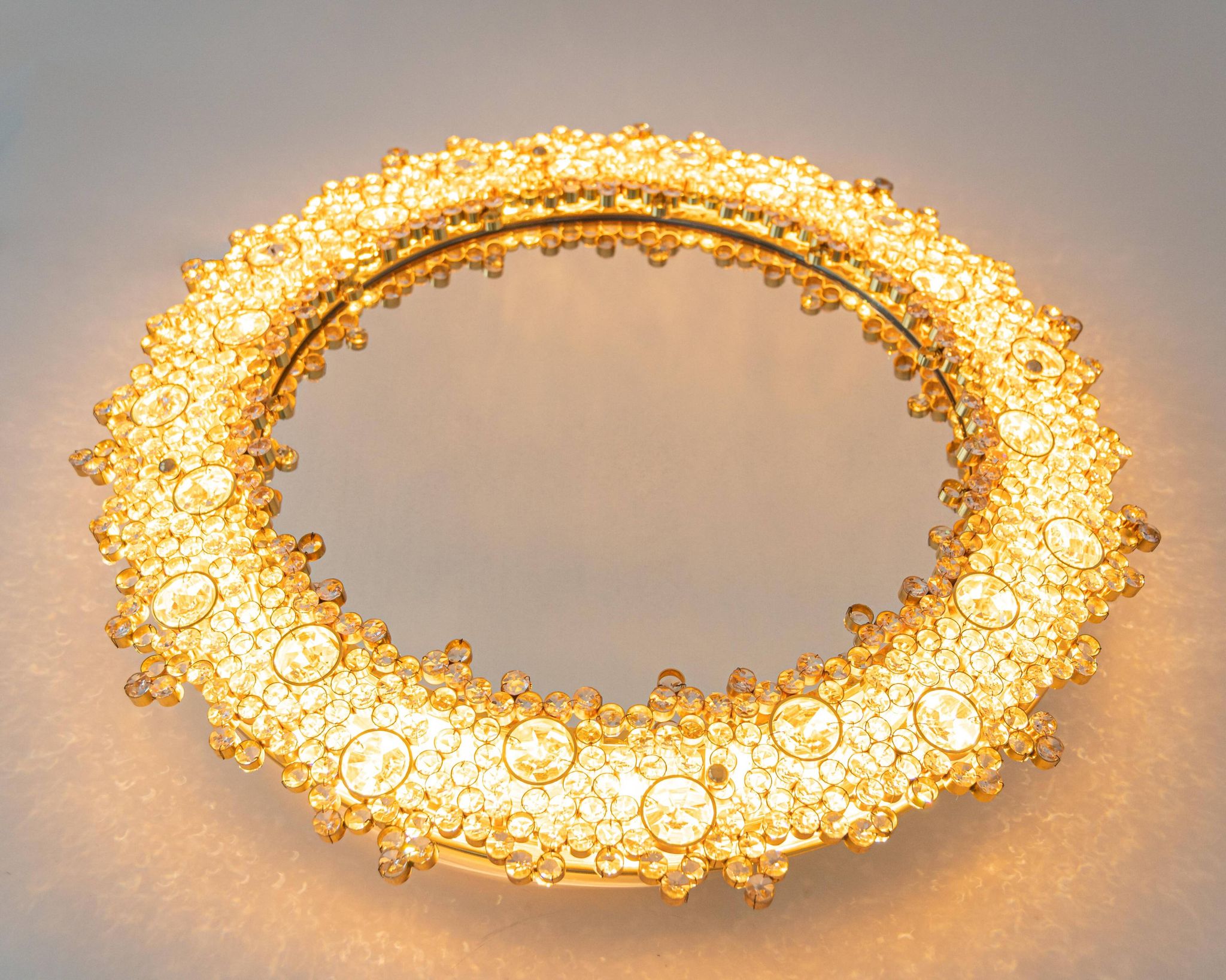 Spectacular backlit mirror in gilded brass and crystal glass by Palwa, Germany.