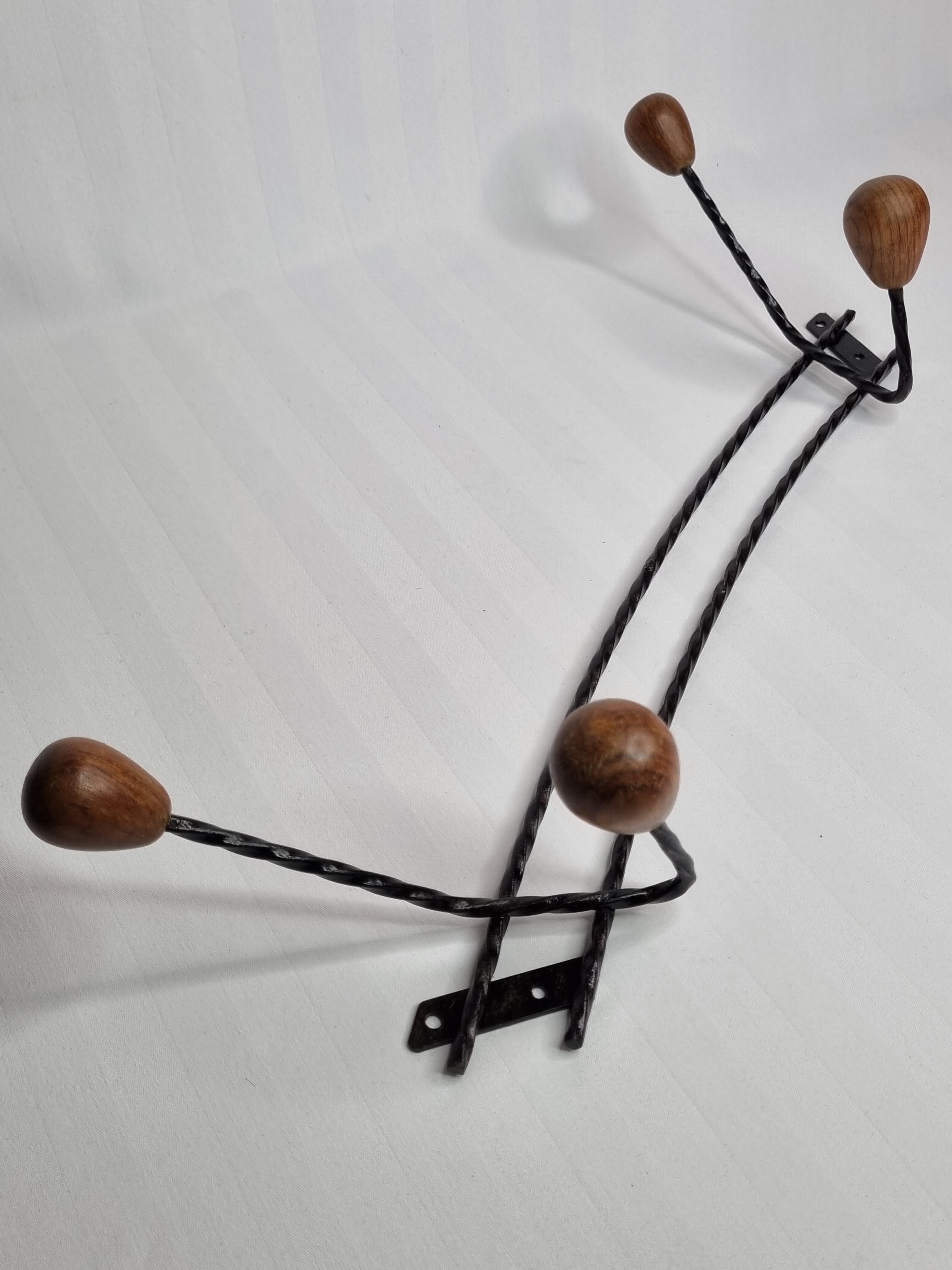 Vintage wood and wrought iron wall rack from the 1950s