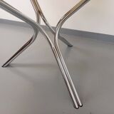 Vintage round dining table in smoked glass and chromed metal, Space Age style, from the 70s