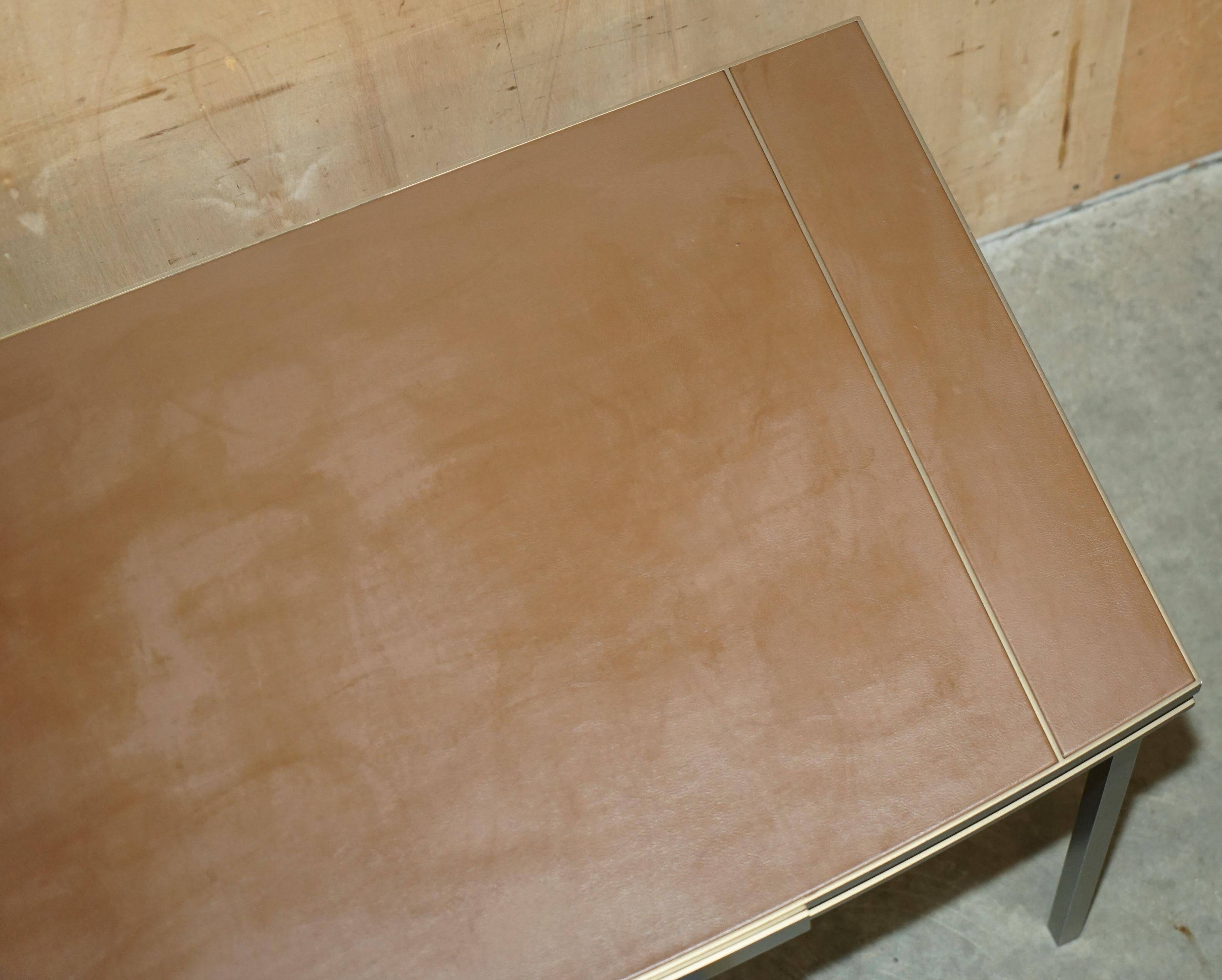 Modern mid-century writing desk signed Cartier in bronze and leather.