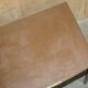 Modern mid-century writing desk signed Cartier in bronze and leather.