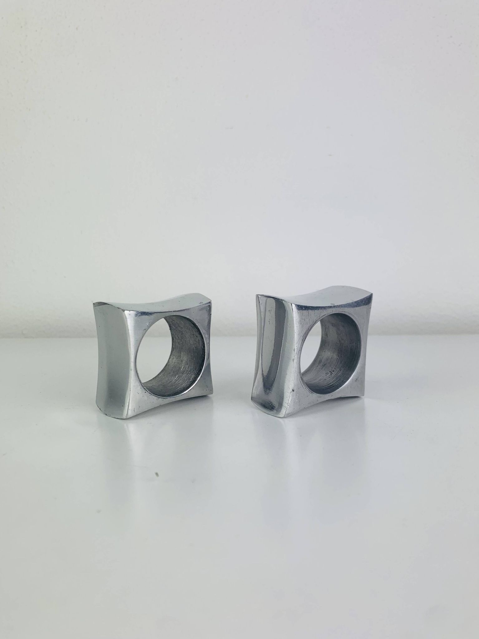 Pair of egg cups or space age napkin rings in aluminium, 1970s.