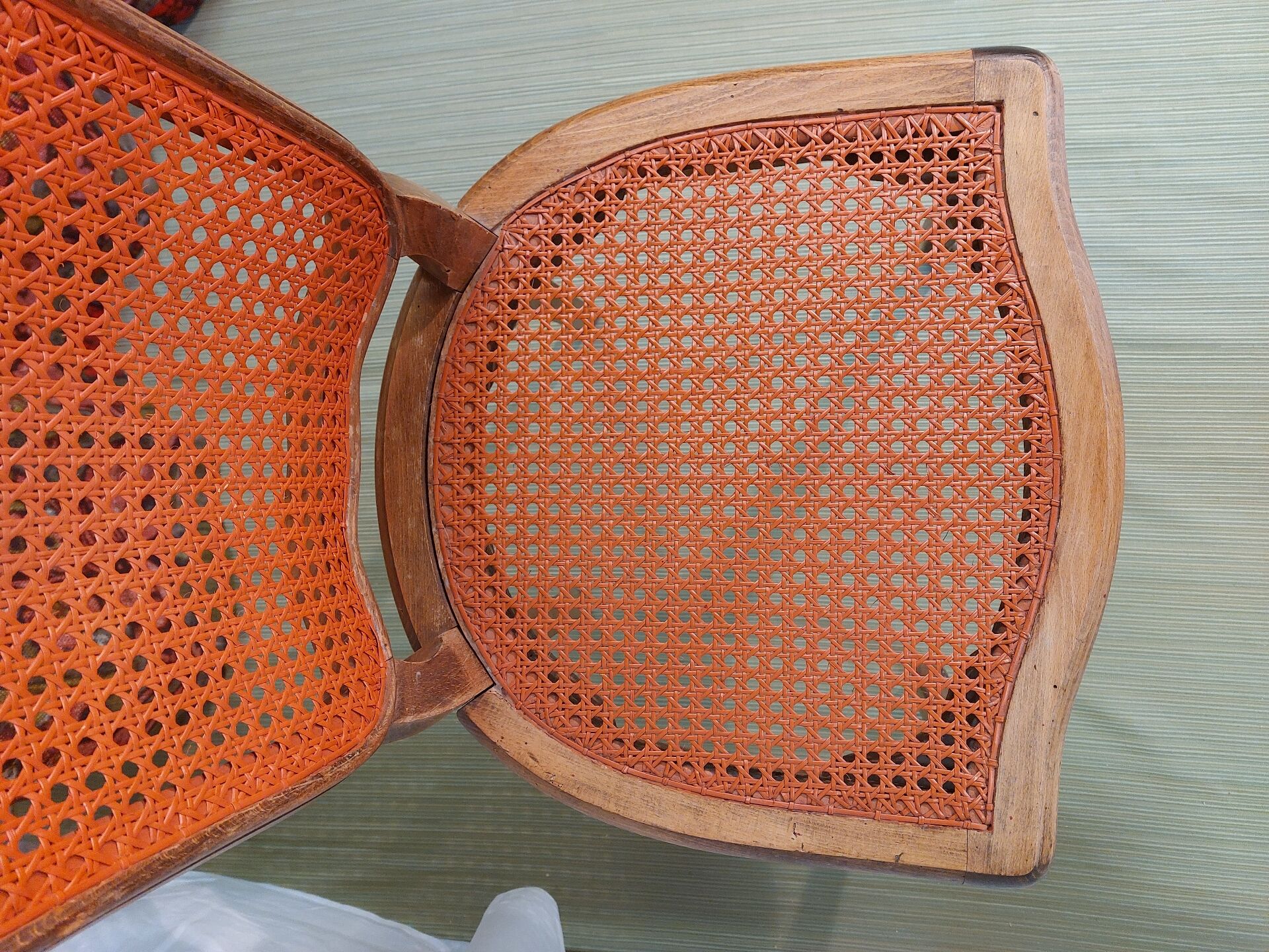 Caned chair in Louis XV style painted orange.