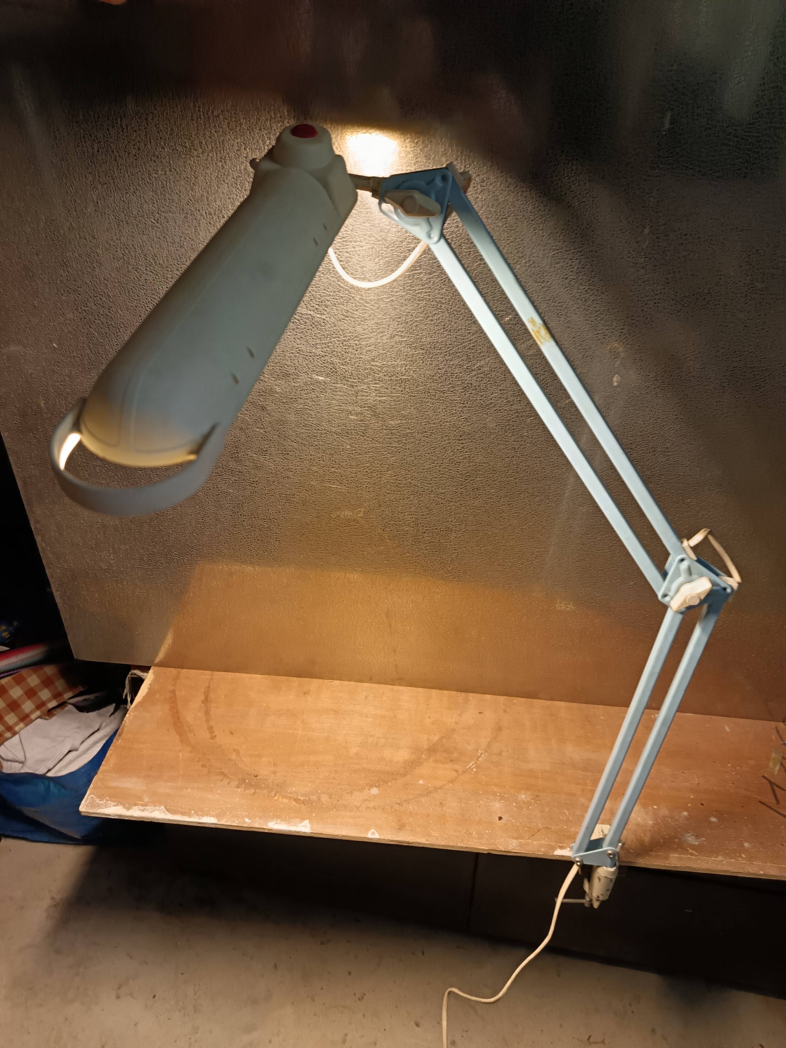Articulated blue desk lamp