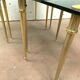 Pull out tables in brass and black glass XX century