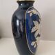 Cobalt blue porcelain vase from Limoges, France with floral pattern.
