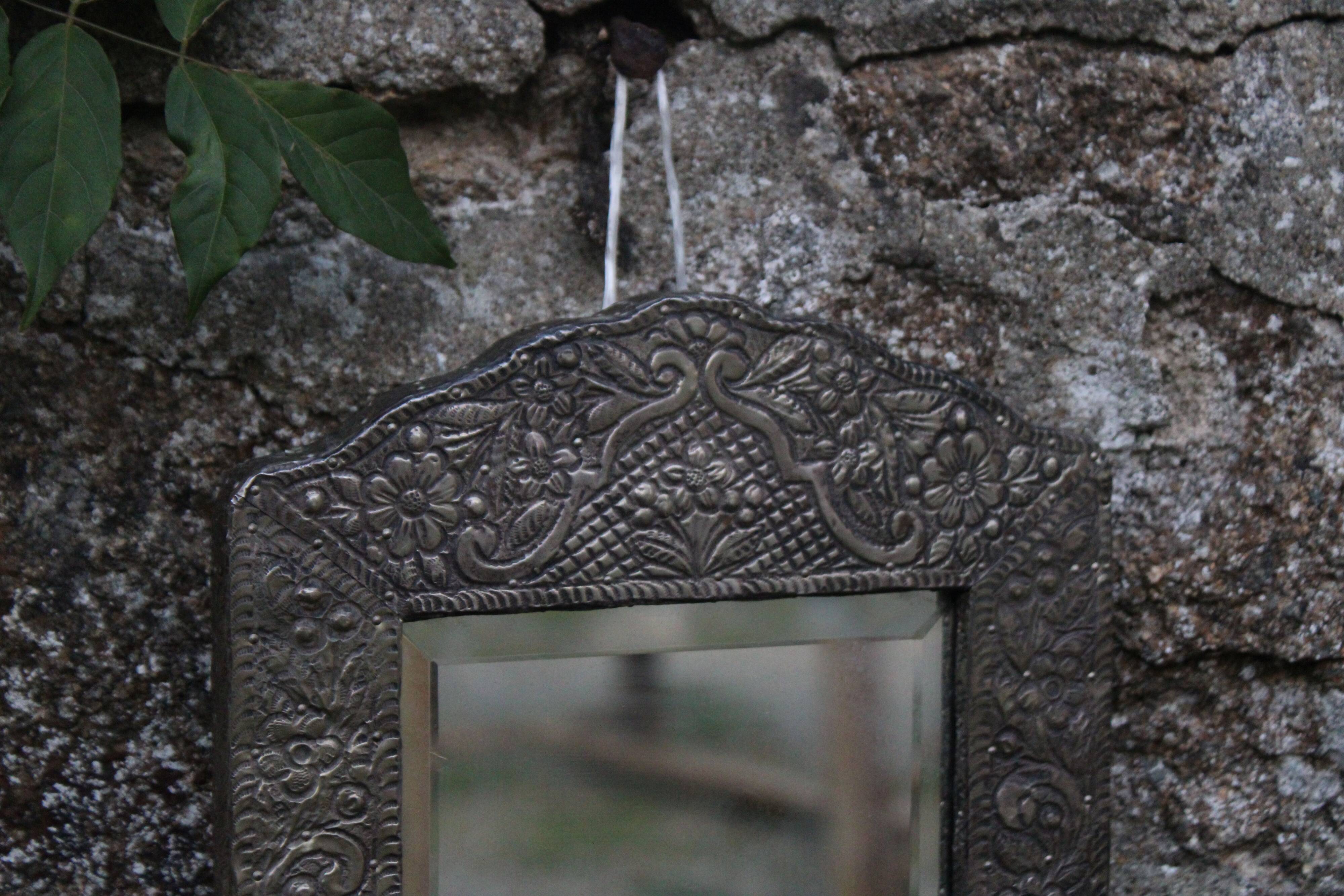Oriental mirror in chiseled metal – beveled, for placing on a surface or hanging