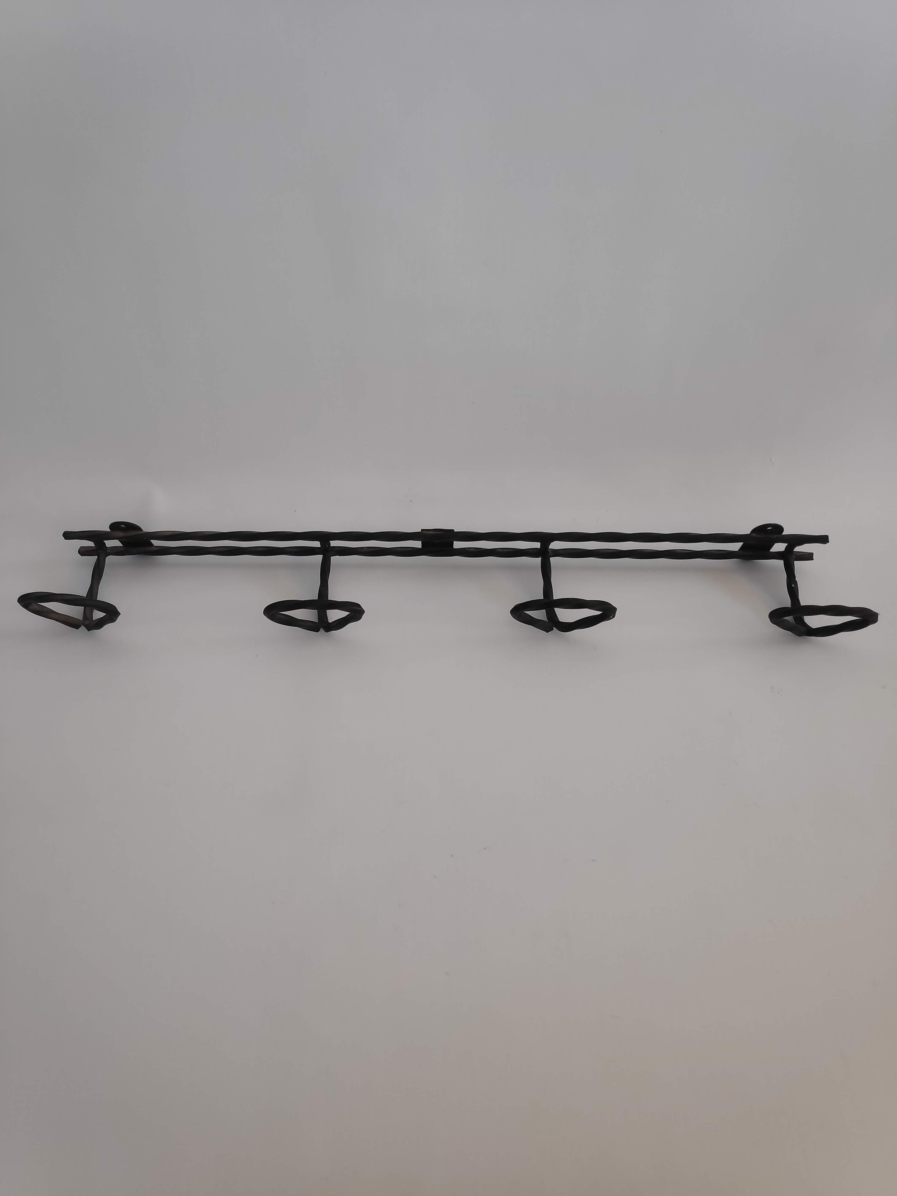 Wall door with 4 twisted metal pads from the 1950s