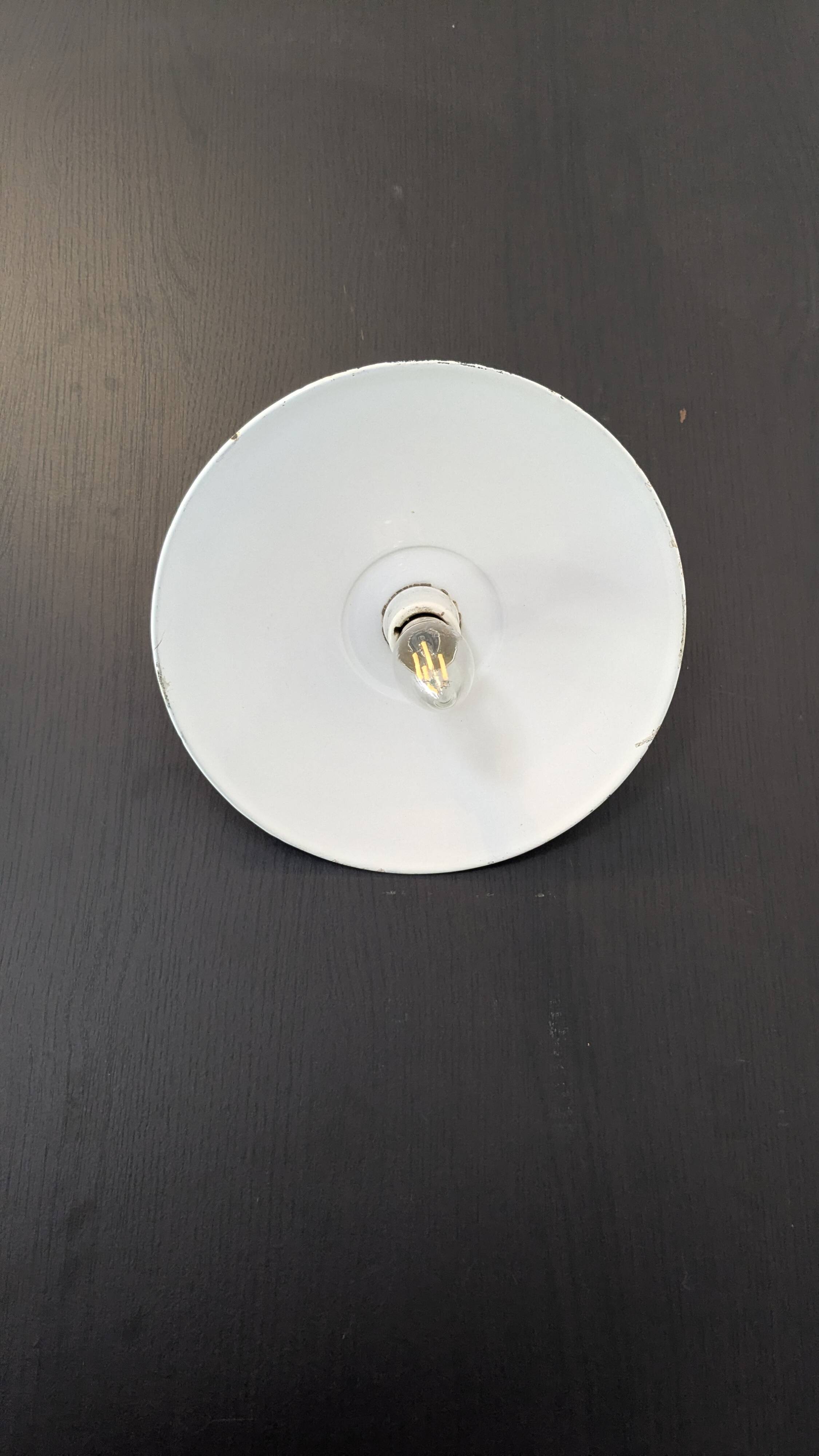 Antique wall light in blue enamel, workshop style.