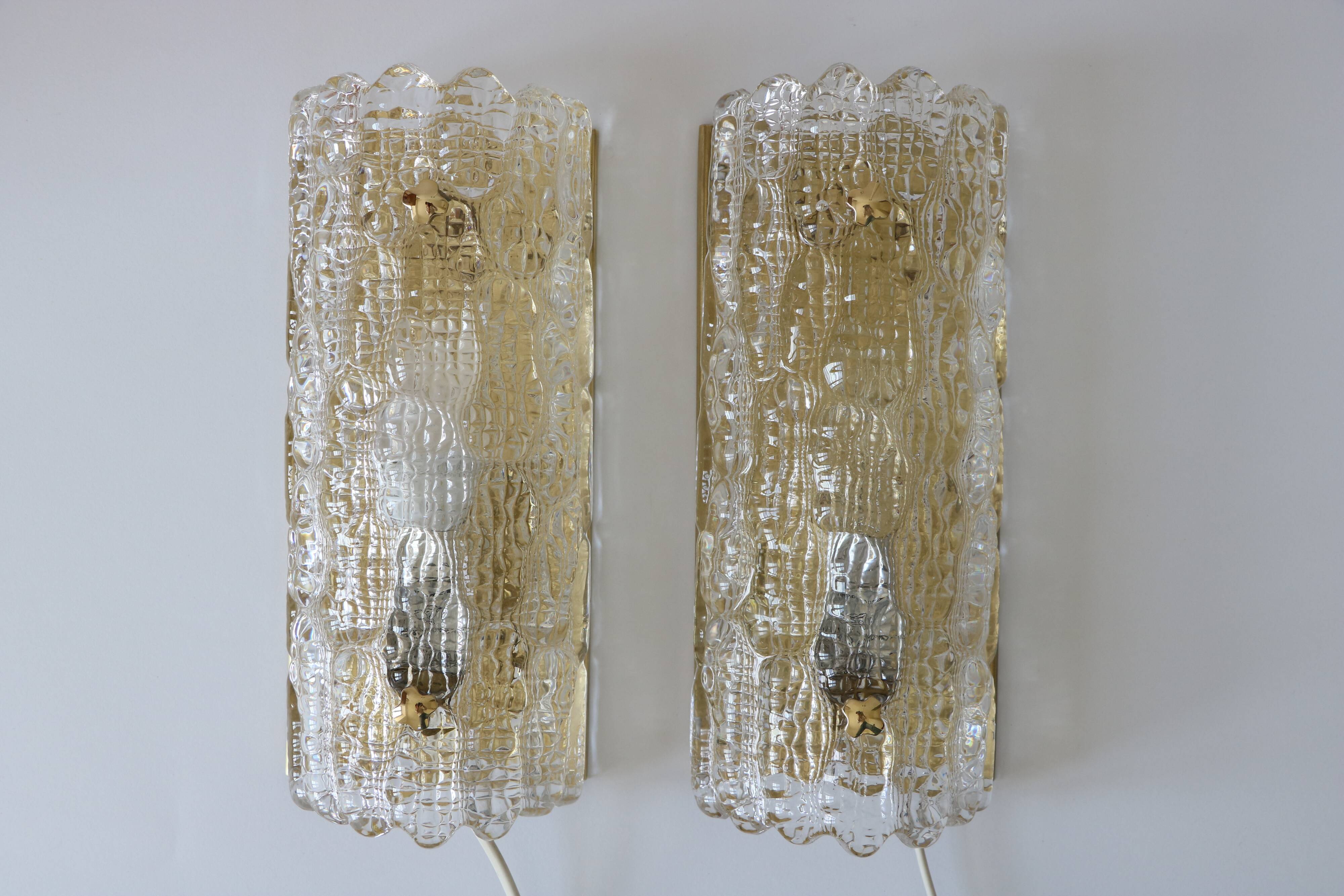 Pair of glass and brass wall lights by Carl Fagerlund for Orrefors.