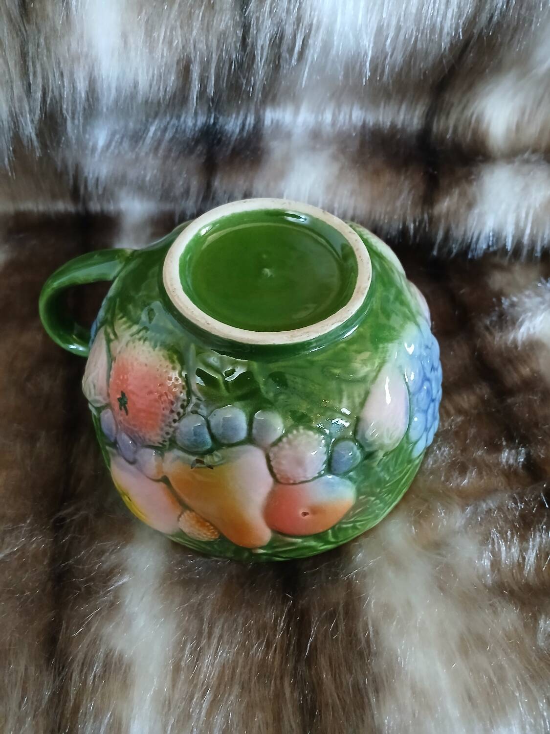 Antique cup and saucer in slipware.