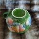 Antique cup and saucer in slipware.