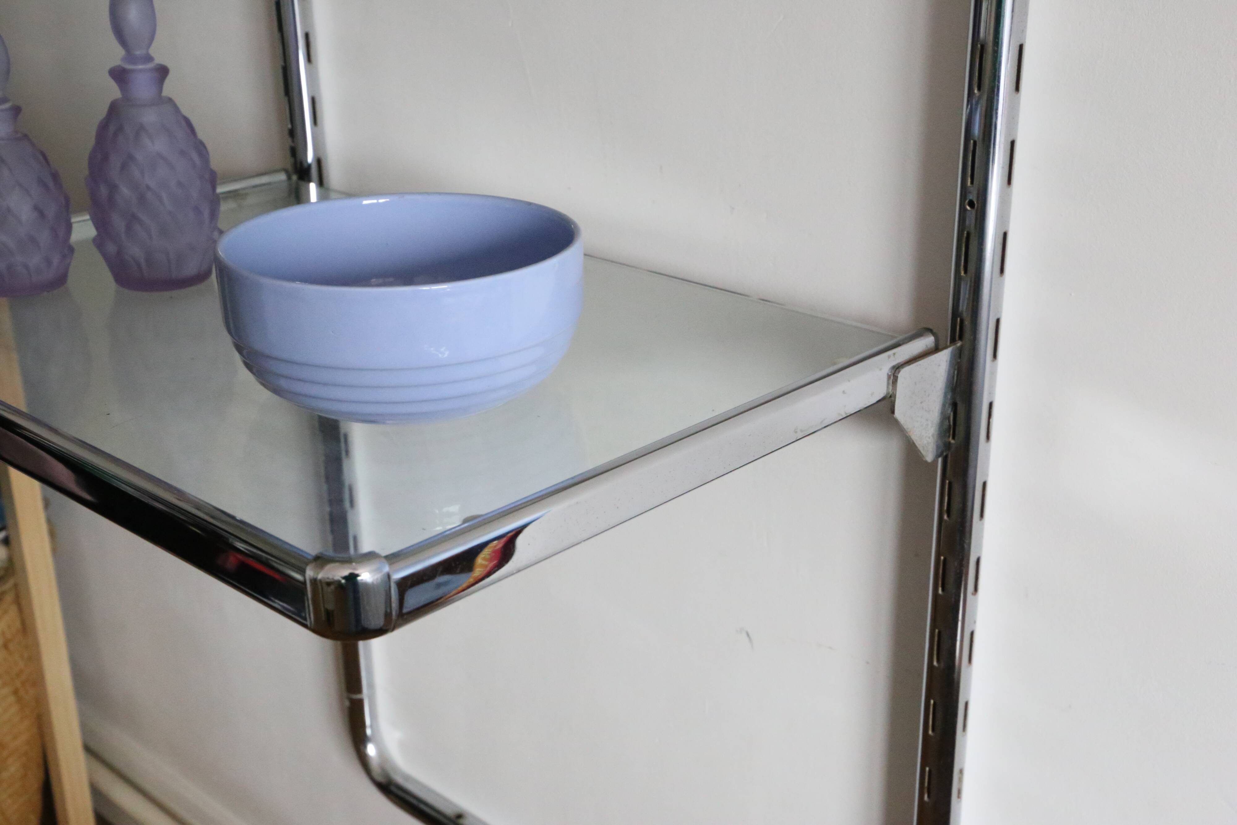 Chrome and glass wall shelf, circa 1960