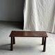 Table basse en teck brun de seconde main indonésienne pieds coniques H37 L8