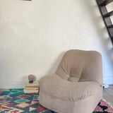 Vintage armchair reupholstered in boucle fabric.