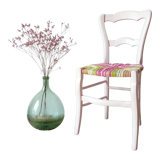 Chair mulched in strands of fabric