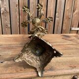 Large bronze candle holder with putti angel