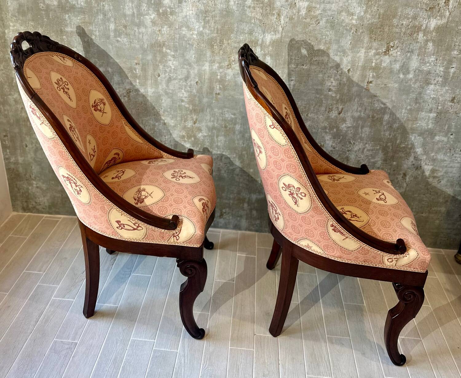 Pair of carved solid mahogany gondolas from the 19th century