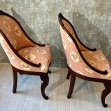 Pair of carved solid mahogany gondolas from the 19th century