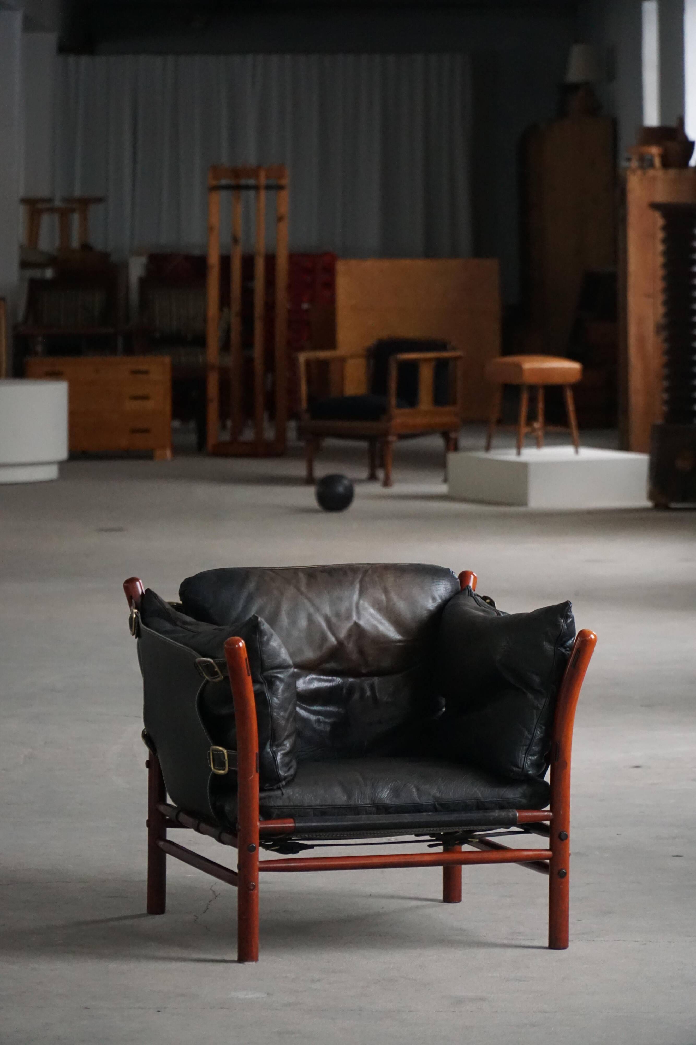"Lounge chair 'Ilona' by Arne Norell in stained beech and leather, mid-20th century."