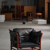 "Lounge chair 'Ilona' by Arne Norell in stained beech and leather, mid-20th century."