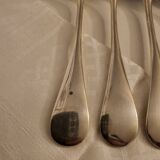12 couverts de table en métal argenté modèle Baguette