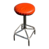 Vintage chrome stool with orange faux leather.