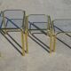 Nested table in gold metal and glass