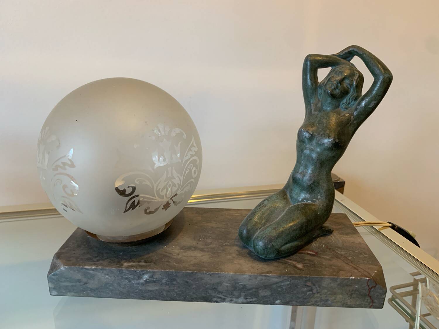 Art Deco lamp with woman and opaline globe on marble