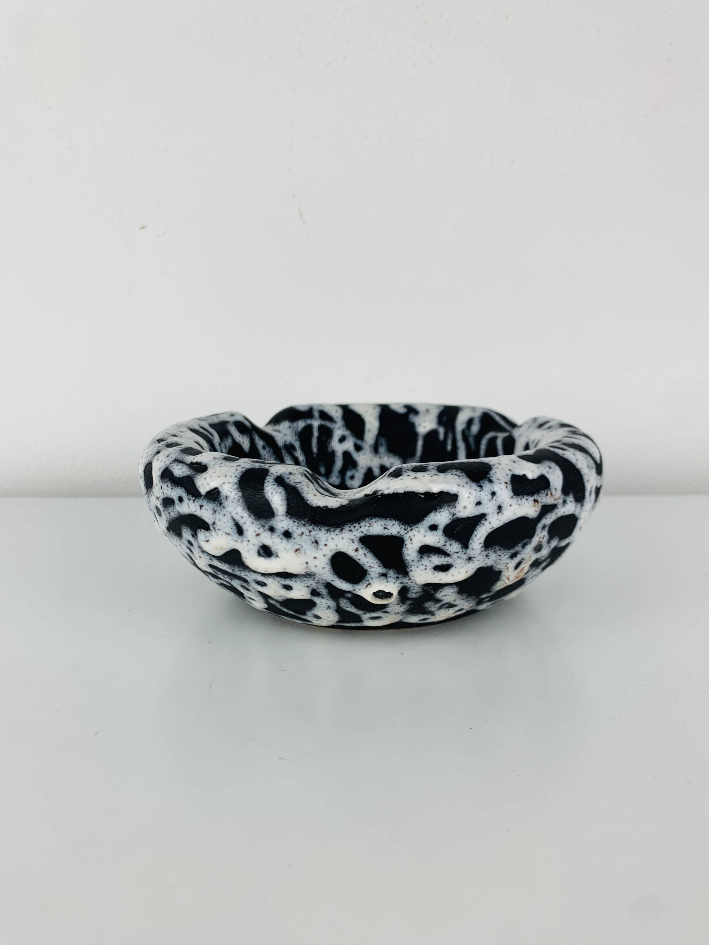 Ashtray and pocket tray by Marius Giuge, fat lava ceramic.