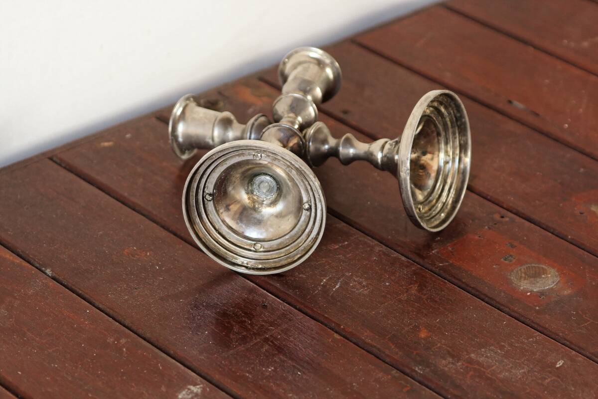 Pair of silver metal candlesticks