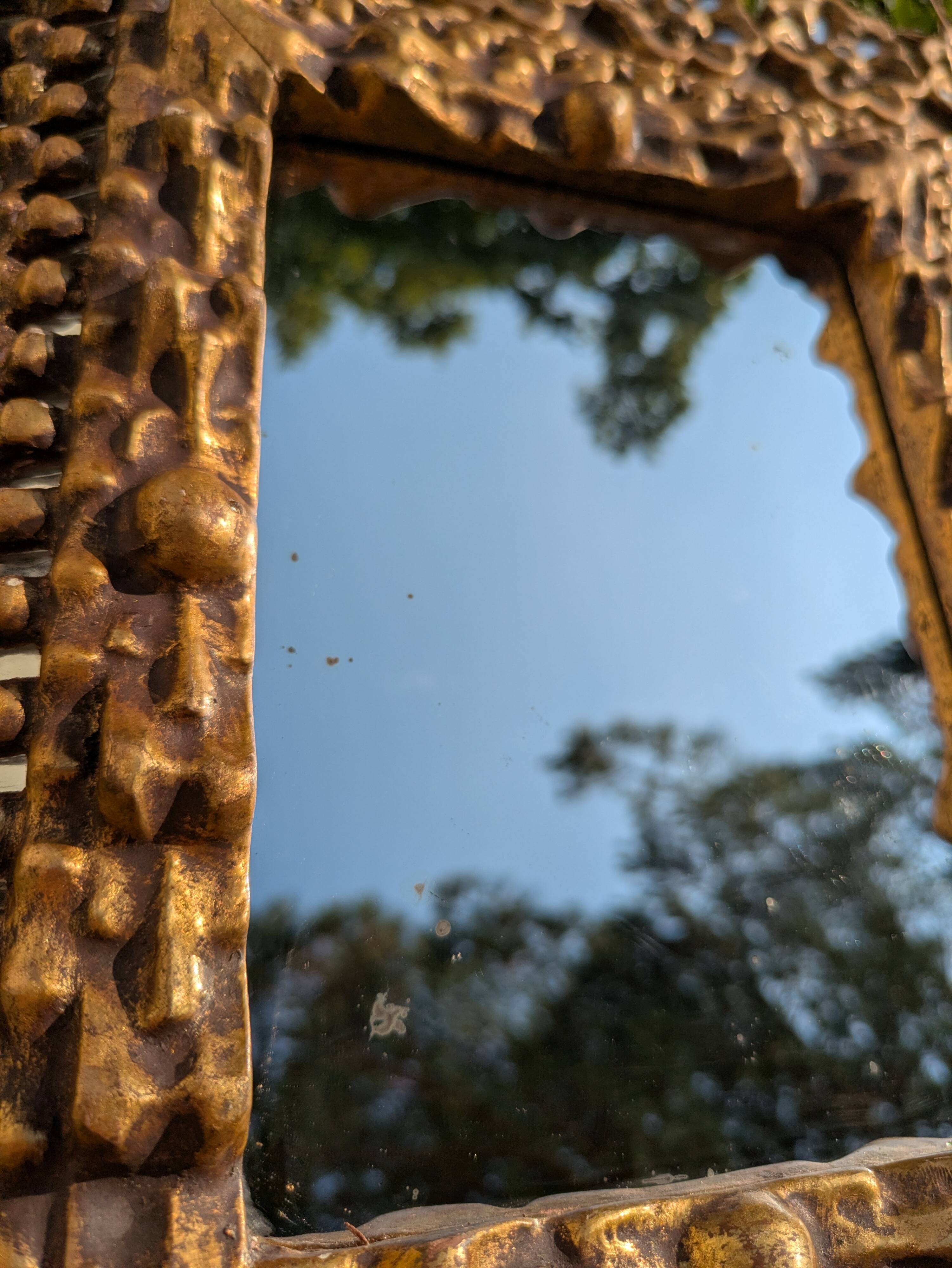 Antique mirror in gilded wood