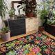 Floral handwoven carpet, colors on a black background - 262x160cm