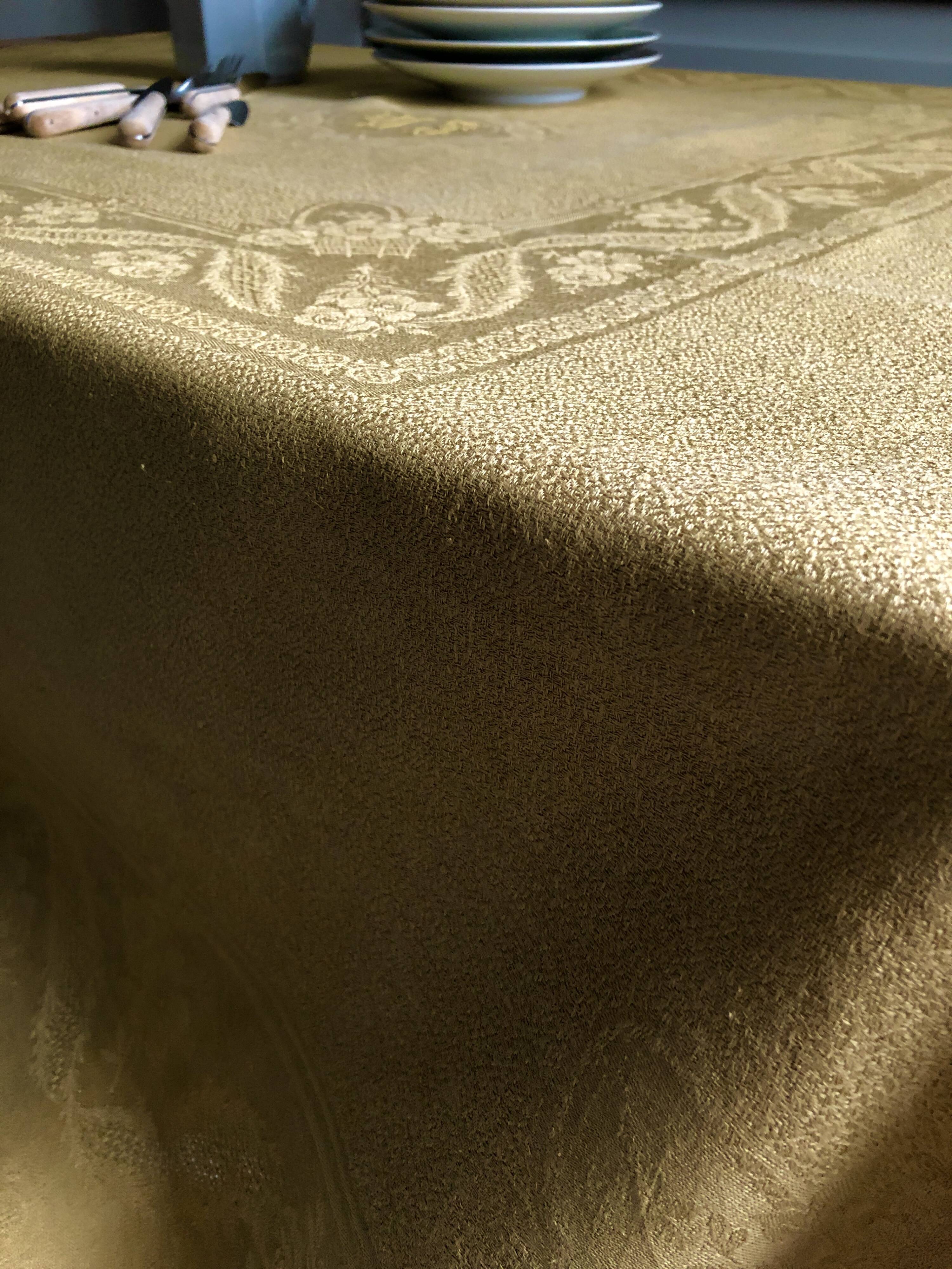 Old linen tablecloth and evening tinted in vermeil