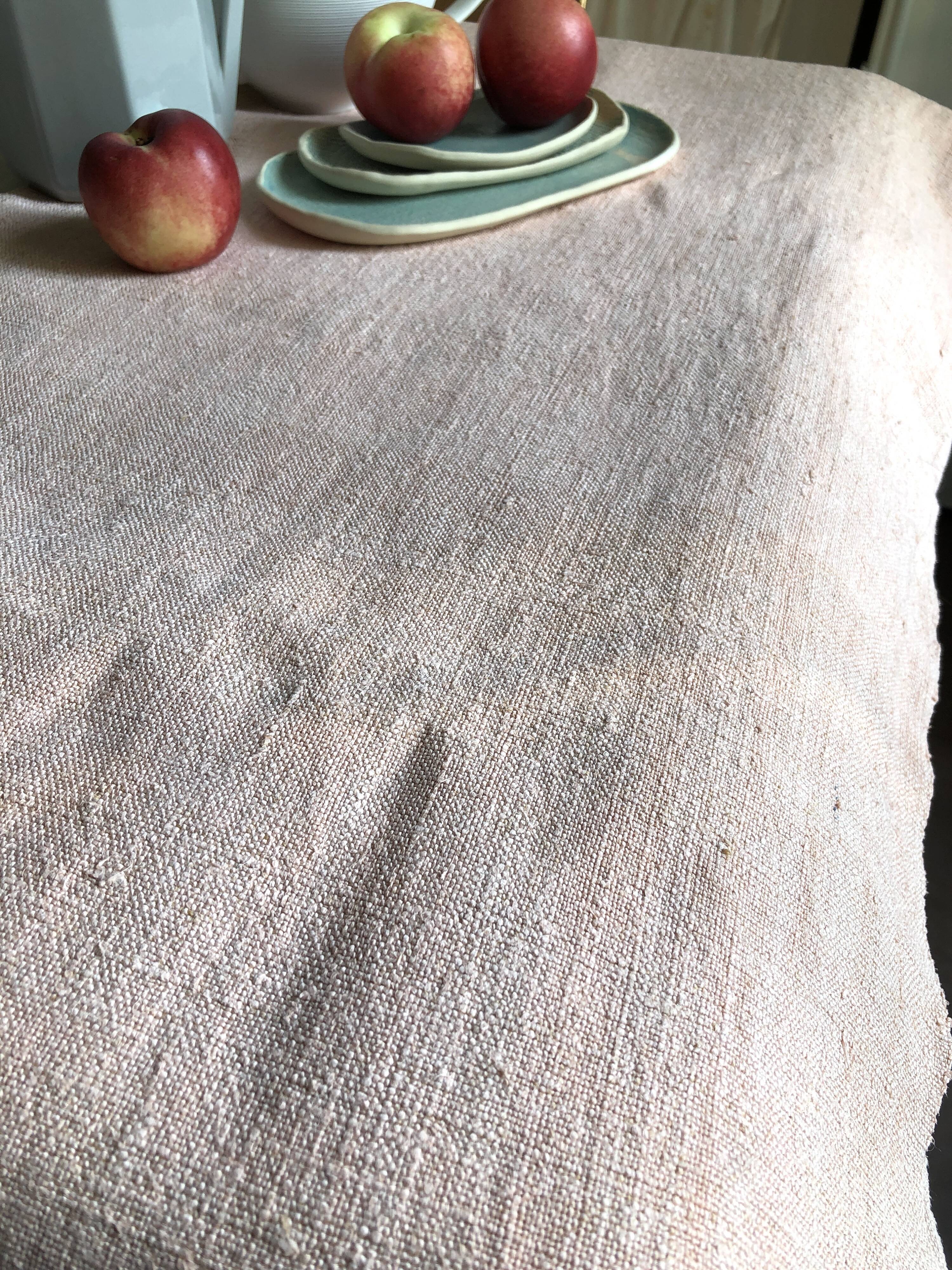 Old hemp harvest tablecloth tinted in pink tea