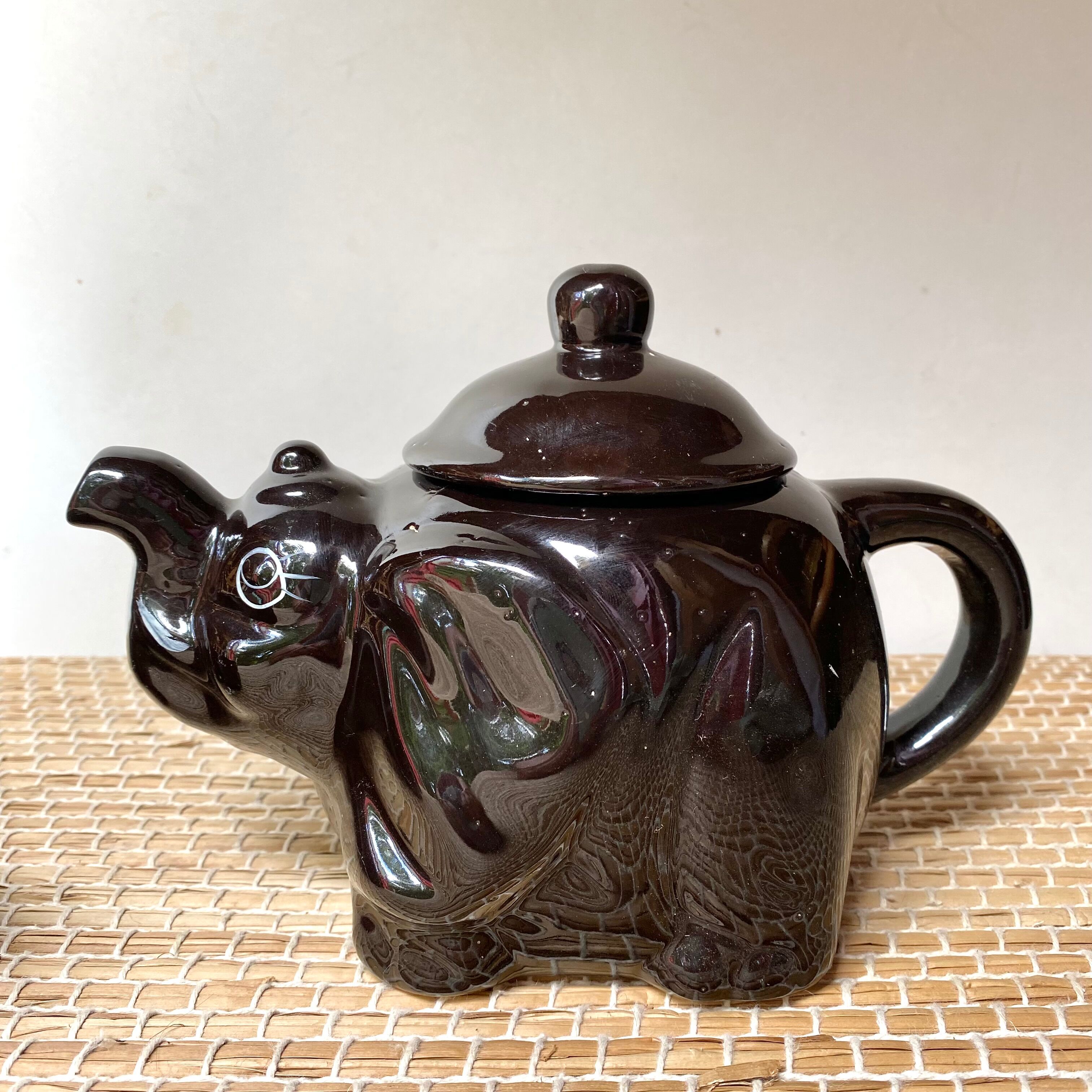 Vintage teapot and vintage elephant cups
