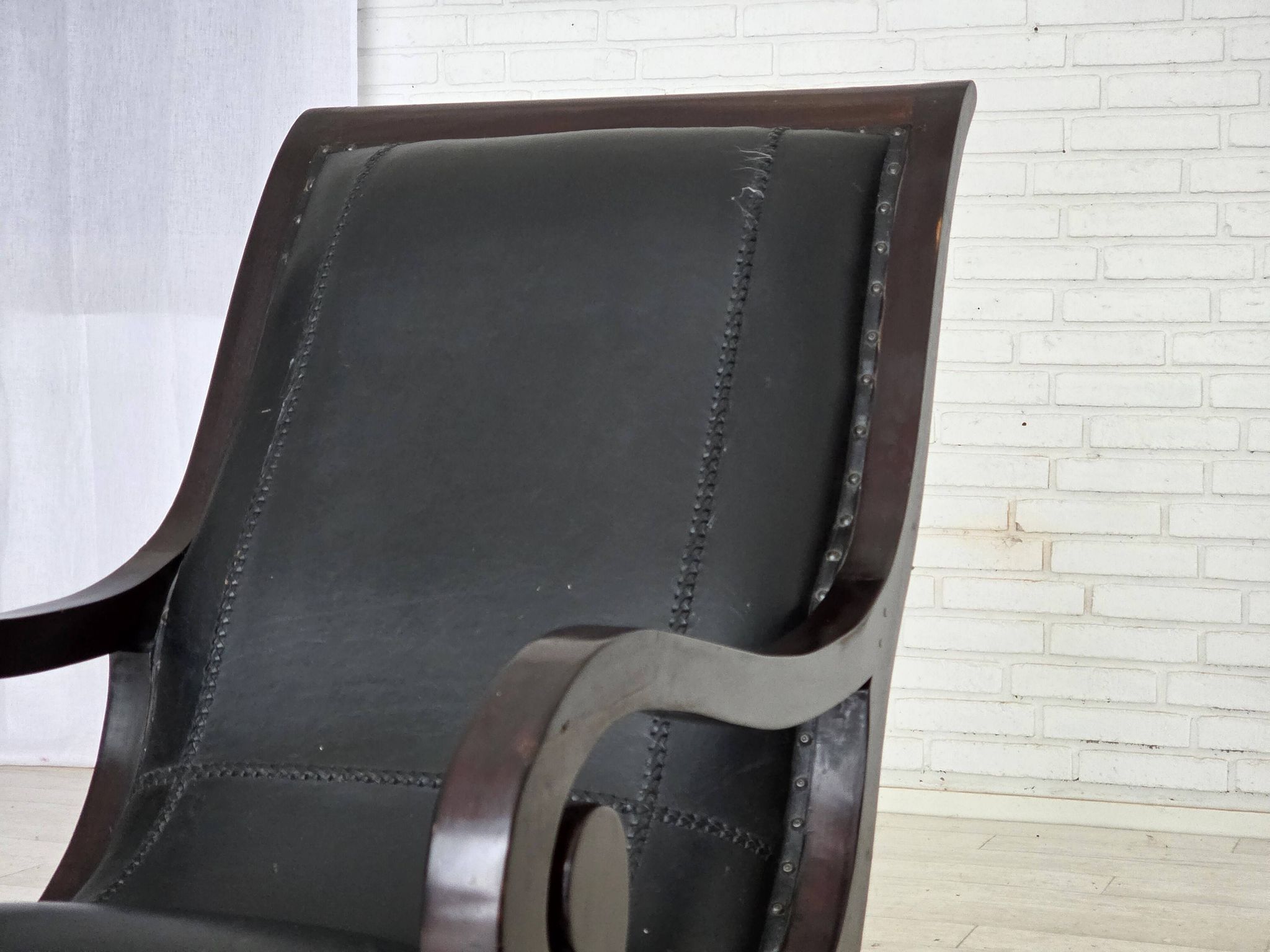 1970s, vintage armchair with footstool, black furniture leather.