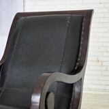 1970s, vintage armchair with footstool, black furniture leather.
