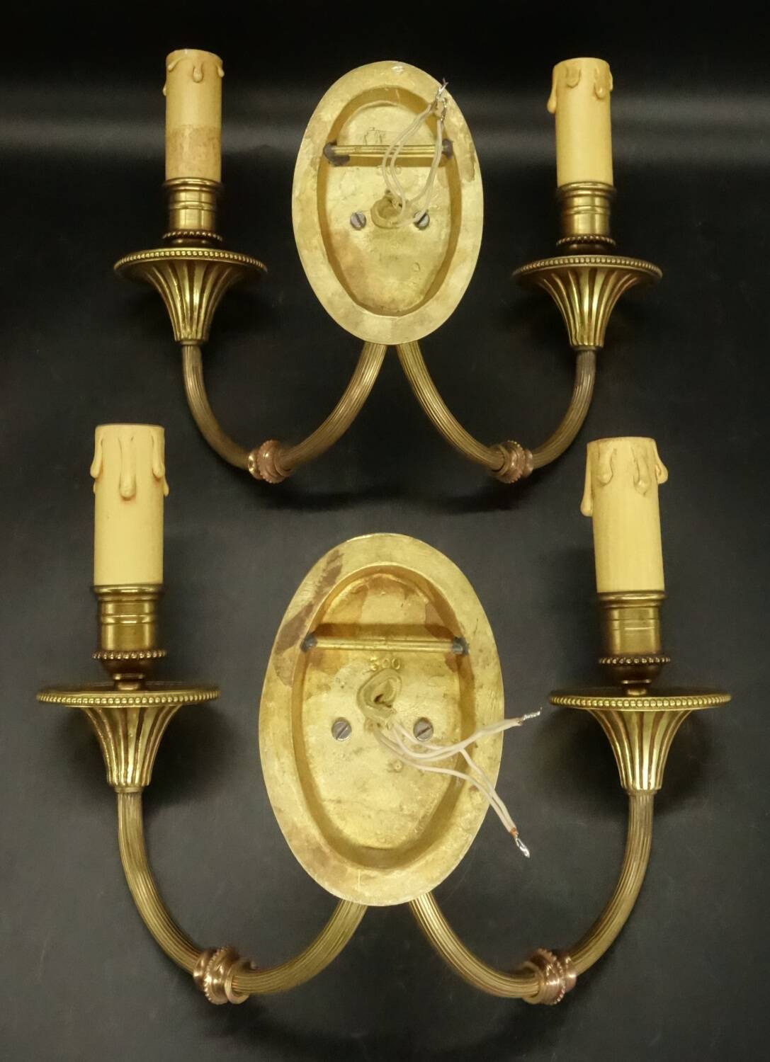 Pair of wall sconces with female masks in Louis XVI style - gilded bronze