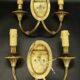 Pair of wall sconces with female masks in Louis XVI style - gilded bronze