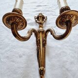 French Empire-style wall sconce or chandelier in bronze with an antique gold patina.