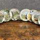 Peter Banett: collection of 12 painted porcelain wall plates