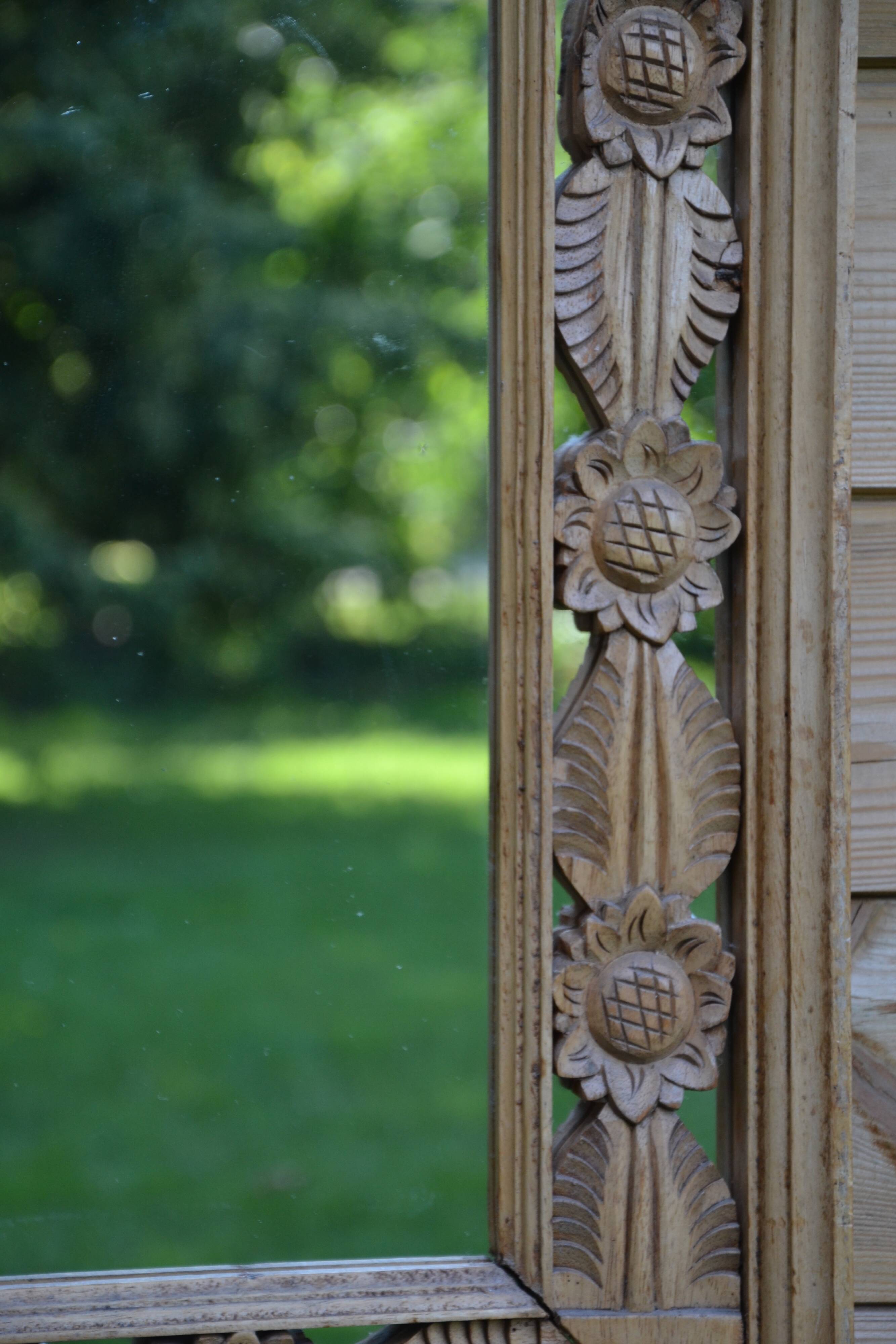 Large carved wooden mirror