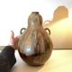 art nouveau brown 'colocynth' vase with three handles, roger guerin