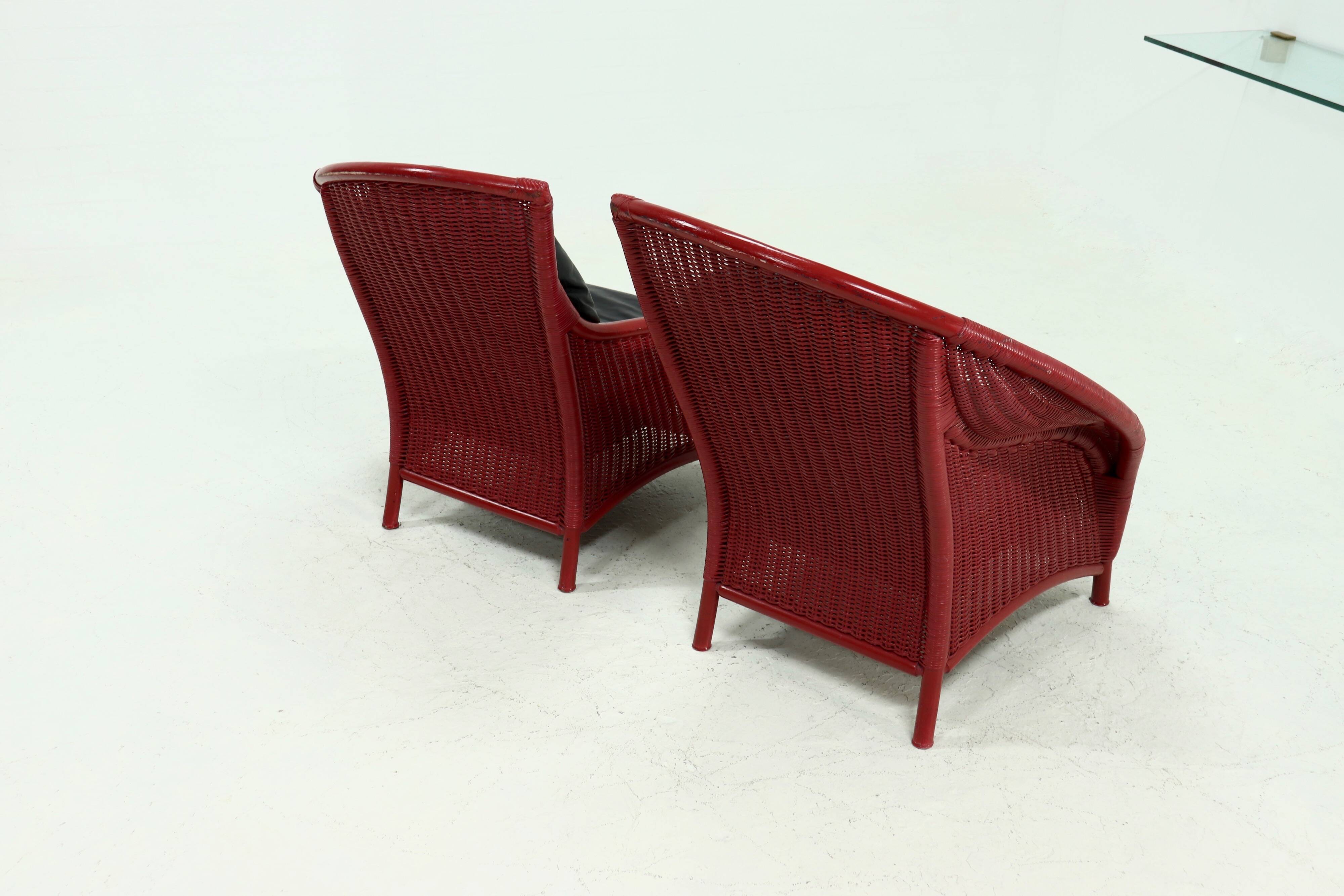 Set of 2 Sculptural Lounge Chairs in Red Lacquered Rattan 1970s