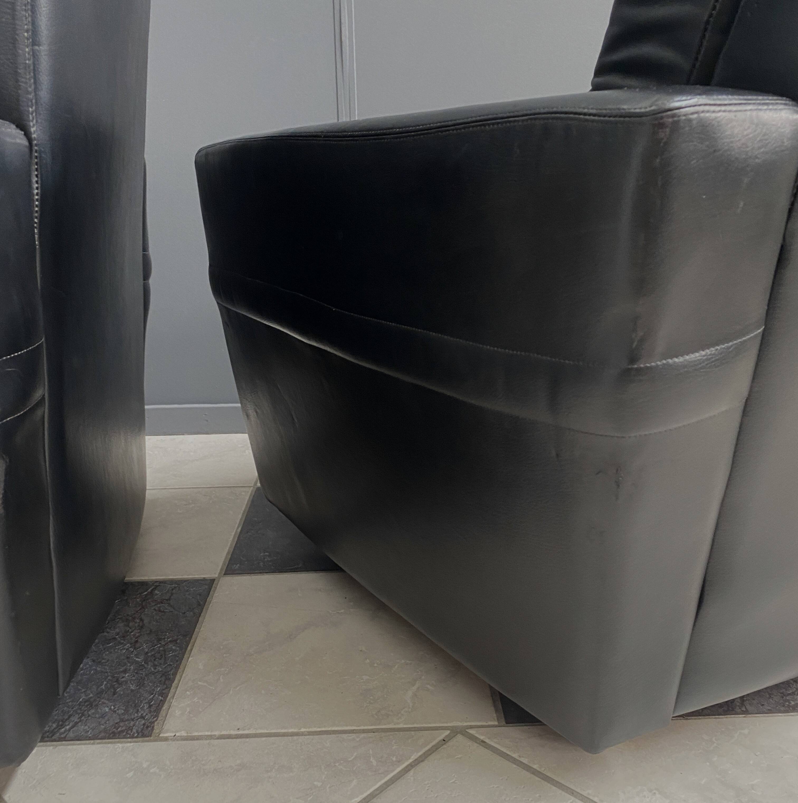 2 Black leather arm chairs 1960s on wheels